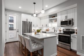 Chesterfield apartment for rent - A modern kitchen with a large island and stainless steel appliances.