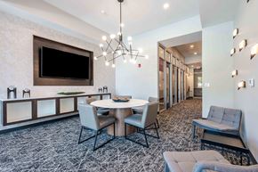 Carmel apartment for rent - A modern dining room with a large table and chairs.