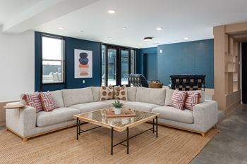 A living room with a couch and a coffee table