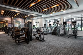 Saint Charles apartment for rent - Large modern fitness center with cardio equipment and strength training machines  at Chapter at the Streets of St Charles, Saint Charles, MO, 63303