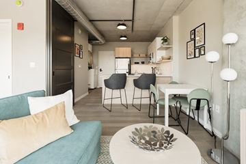 St. Louis apartment for rent - a living room and dining room with a couch and a table