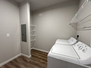 A laundry room with a washer and dryer