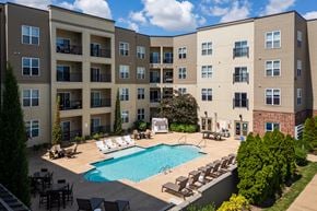 Saint Louis apartment for rent - A large apartment complex with a pool in the courtyard.