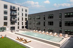 Saint Louis apartment for rent - a swimming pool in the middle of two apartment buildings at The Edwin on Grand Apartments, Missouri