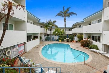 Redondo Beach apartment for rent - A pool in a courtyard surrounded by buildings.