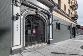 San Francisco apartment for rent - A building with a black gate and a sign that says 1008.