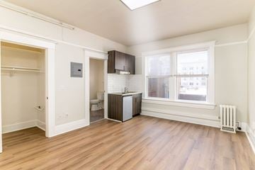 San Francisco apartment for rent - A room with a window and a radiator on the wall.