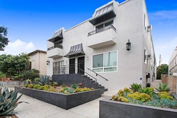 West Hollywood apartment for rent - A modern house with a white exterior and a black roof.
