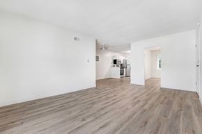 Los Angeles apartment for rent - A room with wooden flooring and white walls.