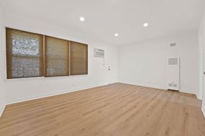 Los Angeles apartment for rent - A room with wooden flooring and a window with blinds.
