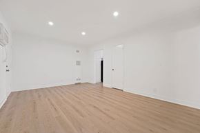 Los Angeles apartment for rent - A room with wooden flooring and white walls.