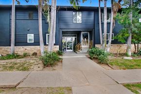 Los Angeles apartment for rent - A black building with a white door and windows.