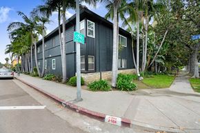 Los Angeles apartment for rent - A green building with a bicycle sign on the front.