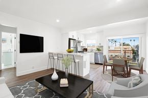 Los Angeles apartment for rent - A modern living room with a flat screen TV and a view of the outdoors.