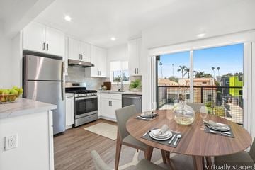Los Angeles apartment for rent - A modern kitchen with a dining table set for two.
