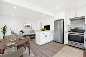 Los Angeles apartment for rent - A modern kitchen with a dining table set for two.