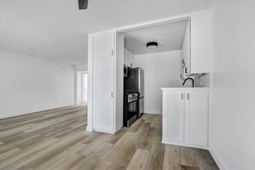 Los Angeles apartment for rent - A kitchen with a white cabinet and a black oven.