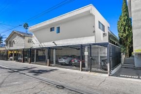 Los Angeles apartment for rent - A white modern house with a black gate in front.