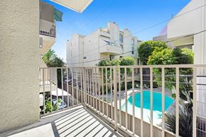 West Hollywood apartment for rent - A balcony with a pool in the background.
