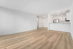 Santa Monica apartment for rent - A room with wooden flooring and white walls.