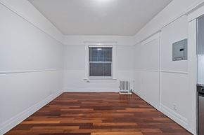 San Francisco apartment for rent - A room with wooden floors and white walls.