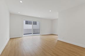 Santa Monica apartment for rent - A room with wooden flooring and a sliding glass door.