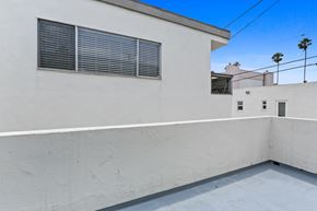 Santa Monica apartment for rent - A white building with a window and a wall.