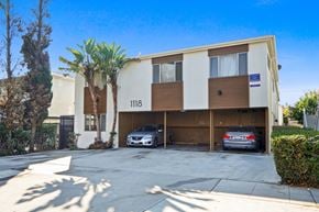 Santa Monica apartment for rent - A two-story building with the number 118 on the front has a car parked in the garage.