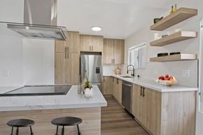 West Hollywood apartment for rent - A modern kitchen with a marble countertop and stainless steel appliances.