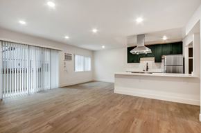 Los Angeles apartment for rent - A kitchen with a white counter and wooden floors.