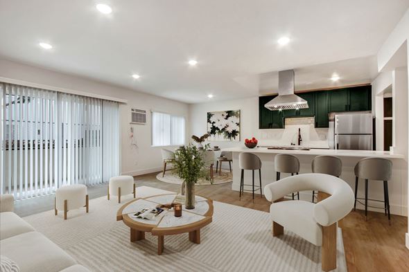 Los Angeles apartment for rent - A modern living room with a white sofa set and a wooden coffee table.