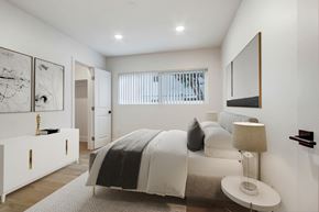 Los Angeles apartment for rent - A bedroom with a bed, nightstand, and artwork on the wall.