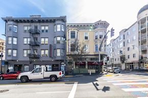 San Francisco apartment for rent - A white pickup truck is parked on the side of the street.