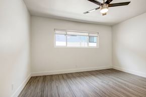 Los Angeles apartment for rent - A room with a ceiling fan and a window.