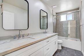 Los Angeles apartment for rent - A white bathroom with a double sink and a toilet.