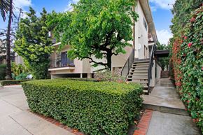 Los Angeles apartment for rent - A house with a tree in front of it.