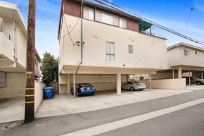 Los Angeles apartment for rent - A blue car is parked in a garage.