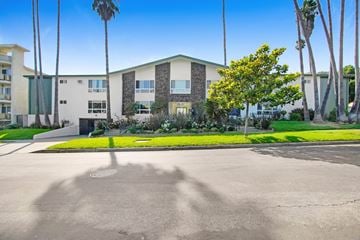 Los Angeles apartment for rent - A building with a green lawn in front of it.