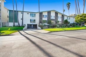 Los Angeles apartment for rent - A sunny day at the apartment complex with palm trees and a clear blue sky.