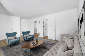 Los Angeles apartment for rent - A living room with a grey rug and a brown coffee table.