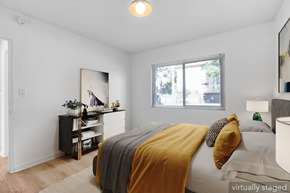 Los Angeles apartment for rent - A bedroom with a bed, nightstand, and a painting on the wall.
