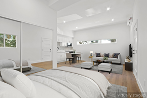 Santa Monica apartment for rent - A white bedroom with a large bed and a couch.