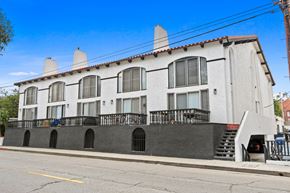 Marina Del Rey apartment for rent - A white building with a black balcony and stairs.