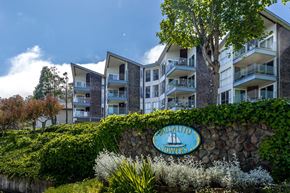 Sausalito apartment for rent - A sign that says Prusalito Towers is in front of a building.