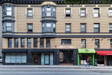 San Francisco apartment for rent - A building with a green awning and a sign that says "12 GOOD".