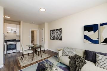 San Francisco apartment for rent - A modern living room with a dining table and chairs.