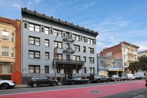 San Francisco apartment for rent - A street view of a city with cars parked on the side of the road.