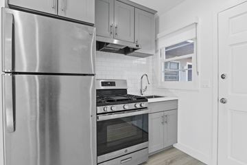 Santa Monica apartment for rent - A modern kitchen with a stainless steel refrigerator and oven.