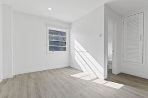 Santa Monica apartment for rent - A room with a window and wooden flooring.