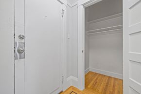 San Francisco apartment for rent - A white door with a silver handle is open to a white interior.